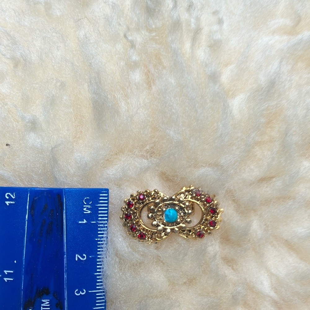 Elegant Gold and Red Brooch with Turquoise Accent